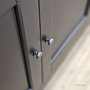 Close up of the brass hardware on the Louis Curved Sideboard