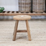 Front view of the lower Vintage Teak Round Stool, highlighting its compact proportions and rich, weathered teak finish.