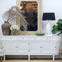 Front view of the Louis Curved Sideboard, emphasizing its gracefully curved frame and sculptural design.