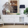 Louis Curved 250cm Sideboard with cabinet doors open, showcasing its ample storage space and interior shelving.