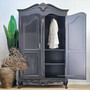 Full view with one door open, revealing the internal hanging rail and removable shelving options.