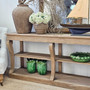 Decorative green ceramics on the bottom shelf, adding colour contrast and charm.