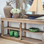 Detail of the bottom shelf with decorative objects, demonstrating styling versatility.