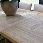 Oak grain detail and parquetry inlays on the Chesterton extendable dining table top.