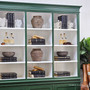 Close-up of the crisp white interior shelving, offering a striking contrast to the rich racer green exterior.