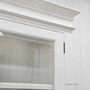 Detail view of the top cornice moulding and bevelled glass to highlight traditional design influence.