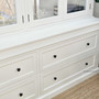 Base drawers photographed under direct light to show construction detail and clean lines.