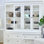 Side view styled in a coastal-themed space to show versatility of placement with hutch doors open