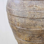 Close-up of the Ravena vessel’s hand-finished surface, with layers of warm clay tones and natural texture.