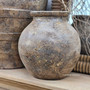 Front view of the Ismara Clay Pot Vessel, highlighting its sculptural round shape and natural clay patina.