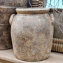 Front view of the Sekar Handled Pot Vessel, showing its rounded silhouette and rustic clay finish.