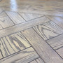 Hand-finished oak parquetry pattern in the Berenson table’s Cigar colour.