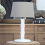 Chippendale bamboo style table lamp in distressed white with taupe shade on timber side table