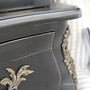 Close-up of drawer edges and gentle fade, showing subtle brushwork and vintage appeal.