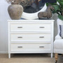 Front view of the Brielle Rattan 3 Drawer Chest in White styled in a modern home