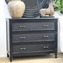 Black Brielle rattan 3 drawer chest styled with decorative objects in a modern hamptons home