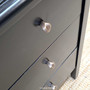 Detail shot of the Creemore 3 Drawer Bedside in Black showing the metal drawer knob and soft satin black finish