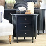 Front view of Creemore 3 Drawer Bedside in Black, showcasing its smooth curved silhouette and deep black painted finish