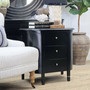 Creemore 3 Drawer Bedside in Black photographed at an angle to showcase the gentle bow-front silhouette and streamlined legs