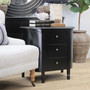 Angled side view of the Creemore 3 Drawer Bedside in Black, highlighting its rounded profile and smooth, satin-finish curves