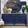 Front View of the Peninsula 7 Drawer chest in Navy with a limewash top styled with a round mirror and decorative ceramics, creating a polished Hamptons-inspired look.