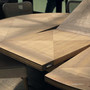 Close-up of the butterfly extension join on the Sycamore round table, illustrating the seamless expandable mechanism.