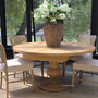 Sycamore round dining table closed at 150cm, styled in a Hamptons interior with natural white cedar top.