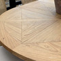 Close-up of the Sycamore white cedar tabletop, showing natural grain, knots and organic characteristics of the extendable dining table.
