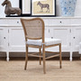 Back angled view of the  Noda Rattan Chair with optional Blue Stripe Cushion, perfect for a modern Hamptons home