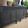Angled low view of the 300cm Louis Sideboard, highlighting the striking black paint-stroke finish and elegant proportions.
