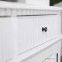 Close-up of the Louis Curved Sideboard’s ribbed fluting details, showcasing the intricate textural elements.