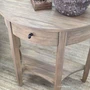 Close-up of the Luna Demilune Side Table highlighting its natural timber grain and softly curved tabletop edge.