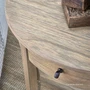Luna Demilune Side Table close-up showcasing the smooth curves of its timber frame and tabletop.