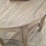 Natural Timber Demilune Side Table close-up featuring its warm finish and elegant curved front.