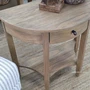 Detailed view of the Luna Side Table lower shelf highlighting its practical open storage design.