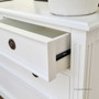 Detail of the metal runners on the drawers, highlighting the blend of quality and functionality in the design.