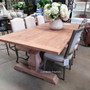 Close-up of the table's rustic top, highlighting the unique texture that makes it perfect for growing families.