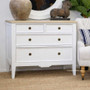 Angled view of the Peninsula 4 Drawer Chest in white with limewash top perfect for any timeless bedroom