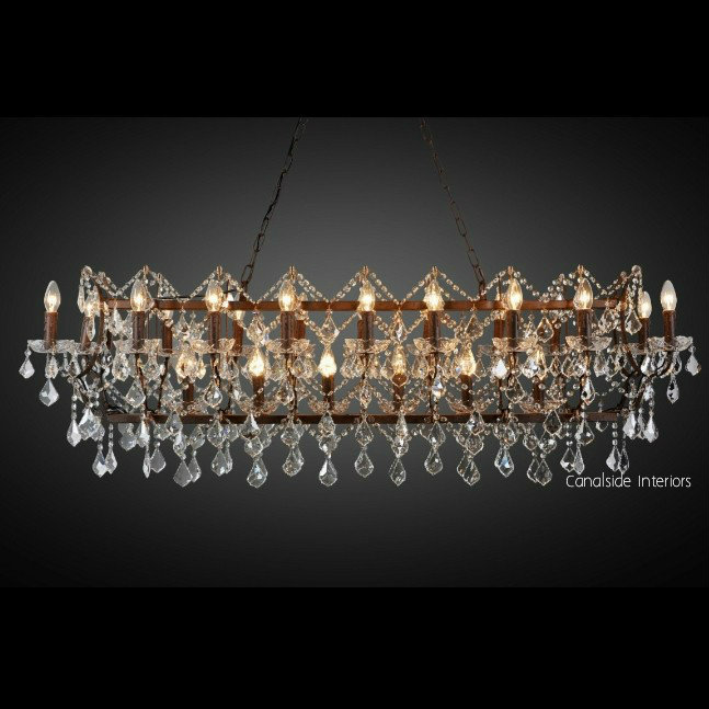 A well-lit image showcases the Rococo Chandelier as a centerpiece in a coastal-inspired living room, where lighting is not just functional but a statement of art
