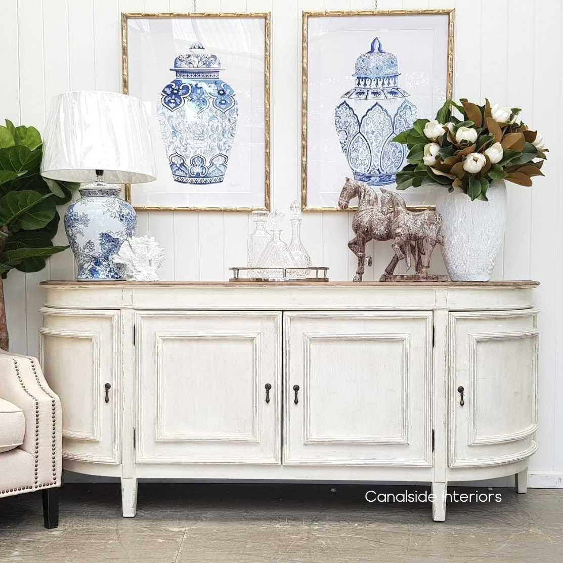The Francia Sideboard from Canalside Interiors, with its stone finish and weathered oak top, provides a classical yet modern elegance perfect for a Hamptons-style bedroom