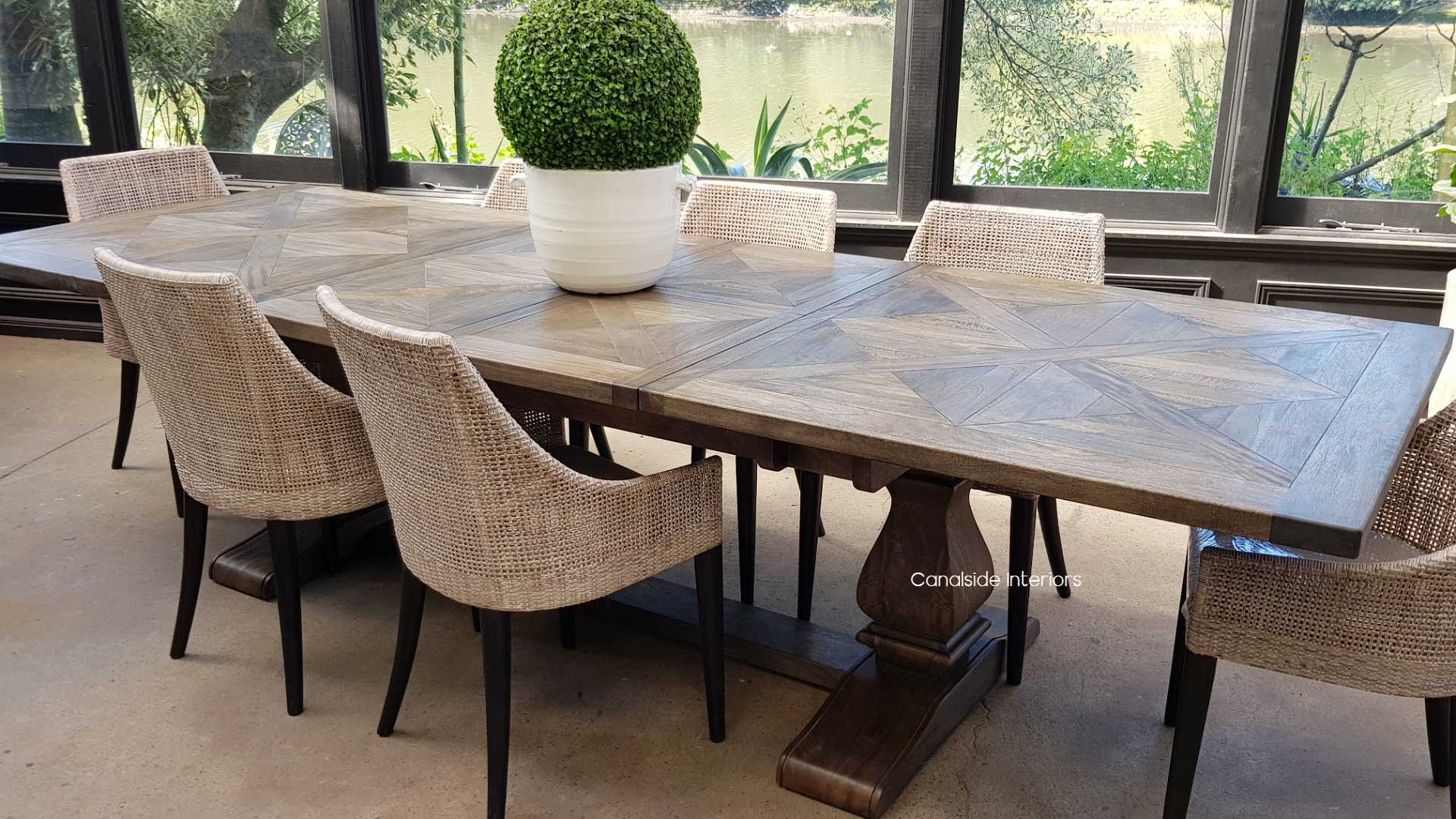 Discover the versatility of the Bridgehampton Dining Table, easily extended to host grand feasts, combining modern functionality with classical, coastal aesthetics -