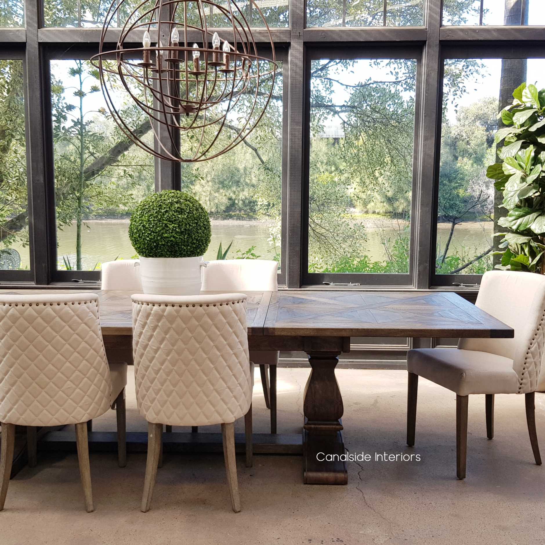 Frontal view of the fully extended Bridgehampton Dining Table, illustrating its spacious surface, ideal for both daily use and special occasions in a timeless dining room setting