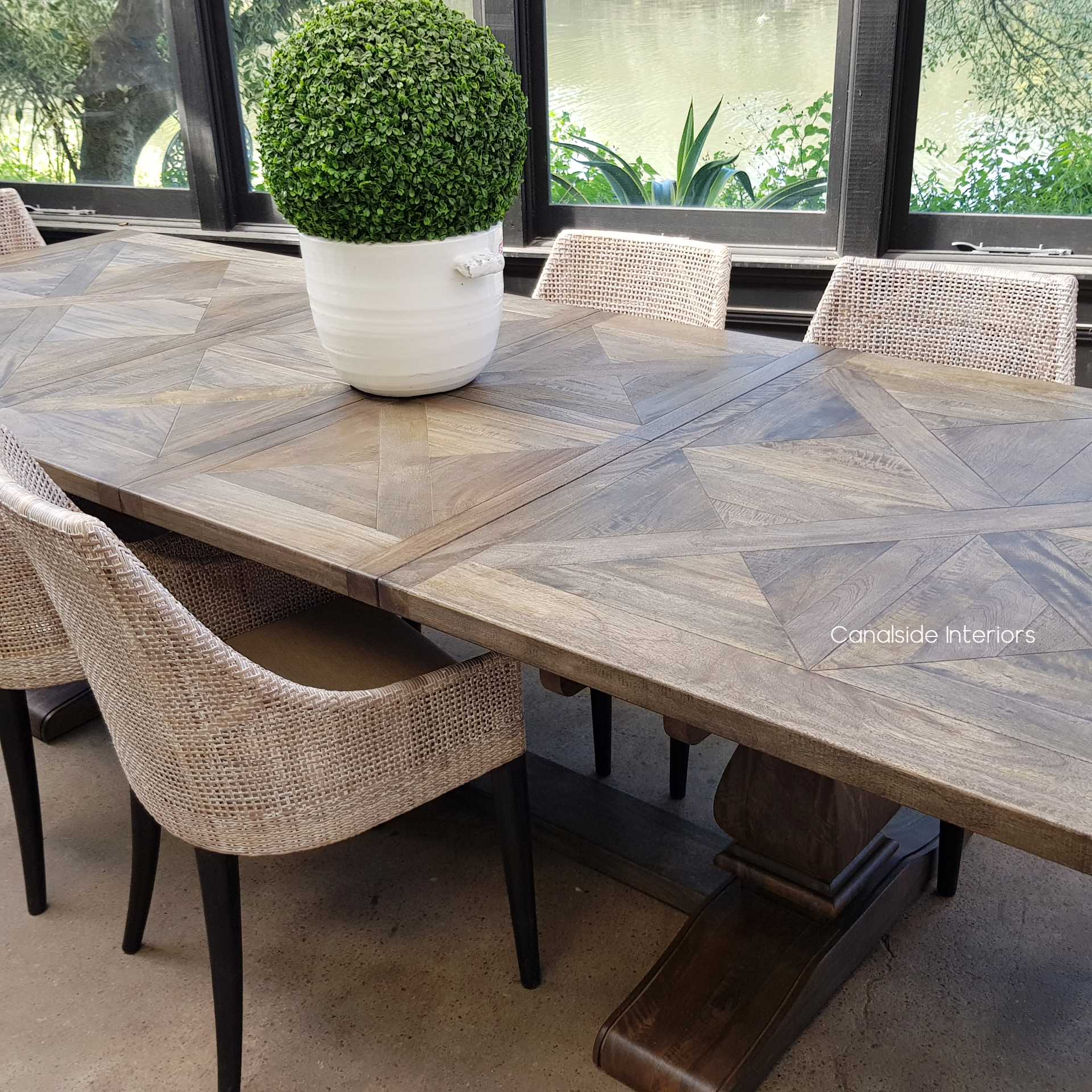 Embrace coastal sophistication in your dining room with the Bridgehampton Parquetry Table, featuring a modern extension system 