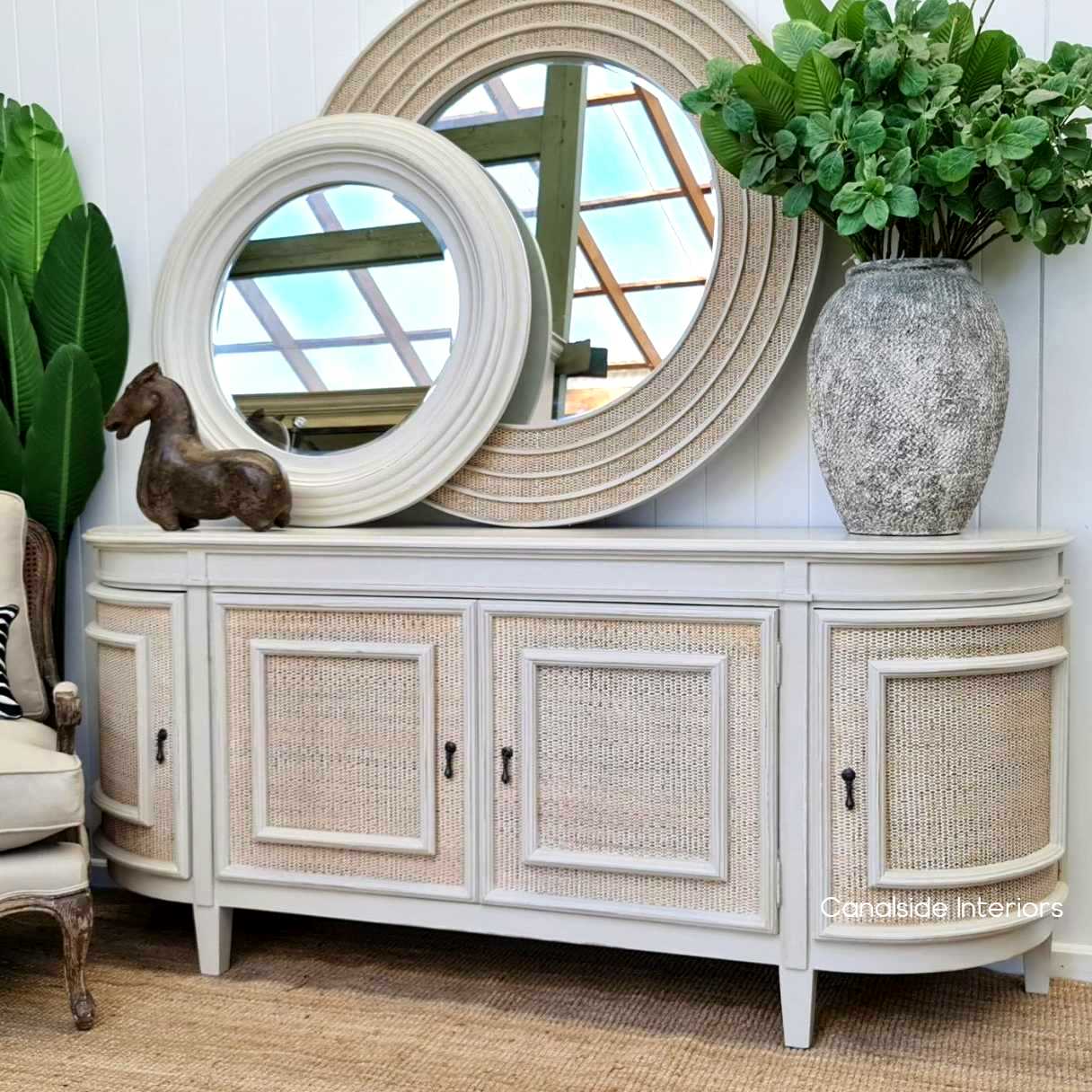 Lounge in luxury with the Francia Sideboard's distressed stone and rattan design, a Canalside Interiors piece that balances classical beauty with modern functionality