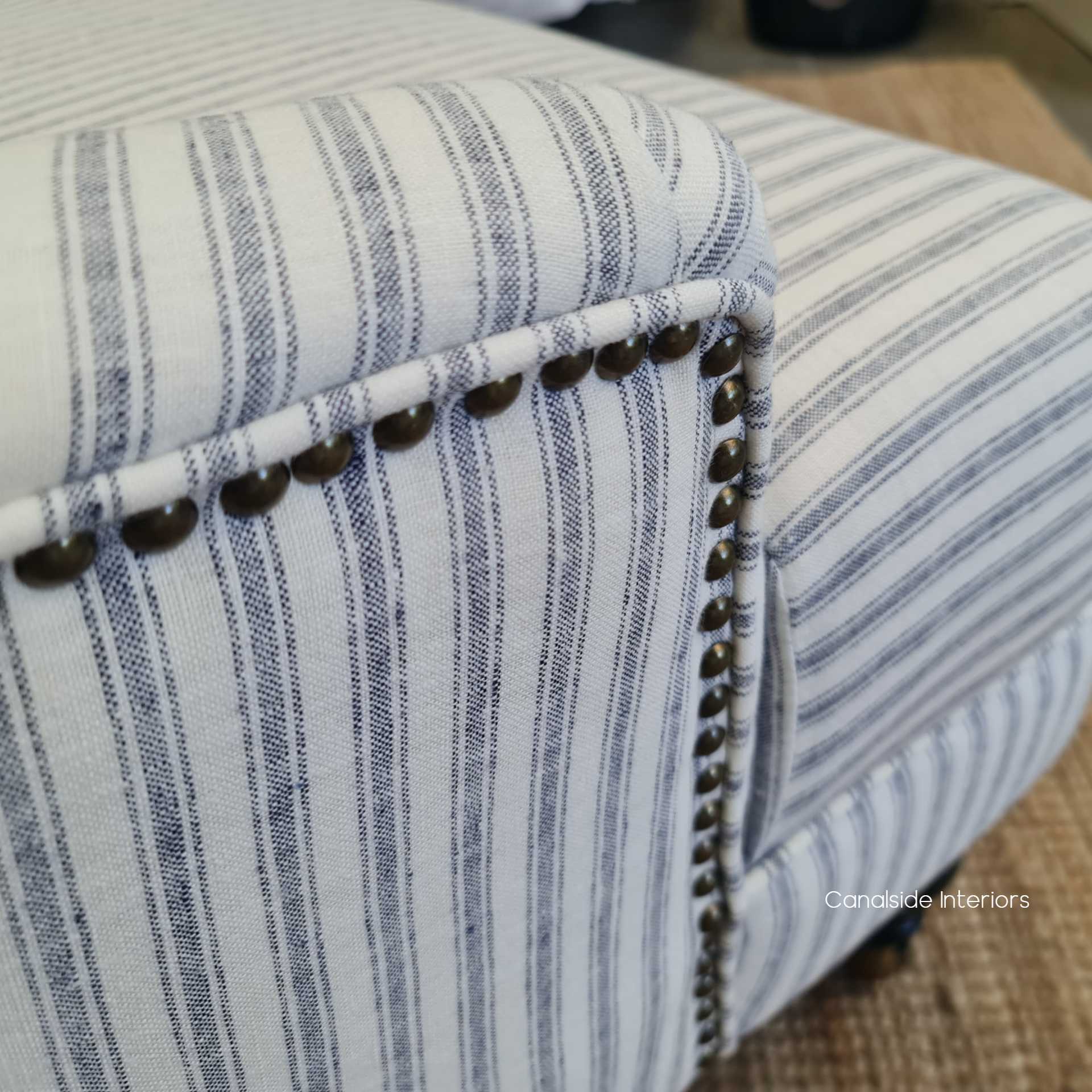 Angled shot illustrating how the armchair complements a classical interior, adding a layer of richness and cultural depth.