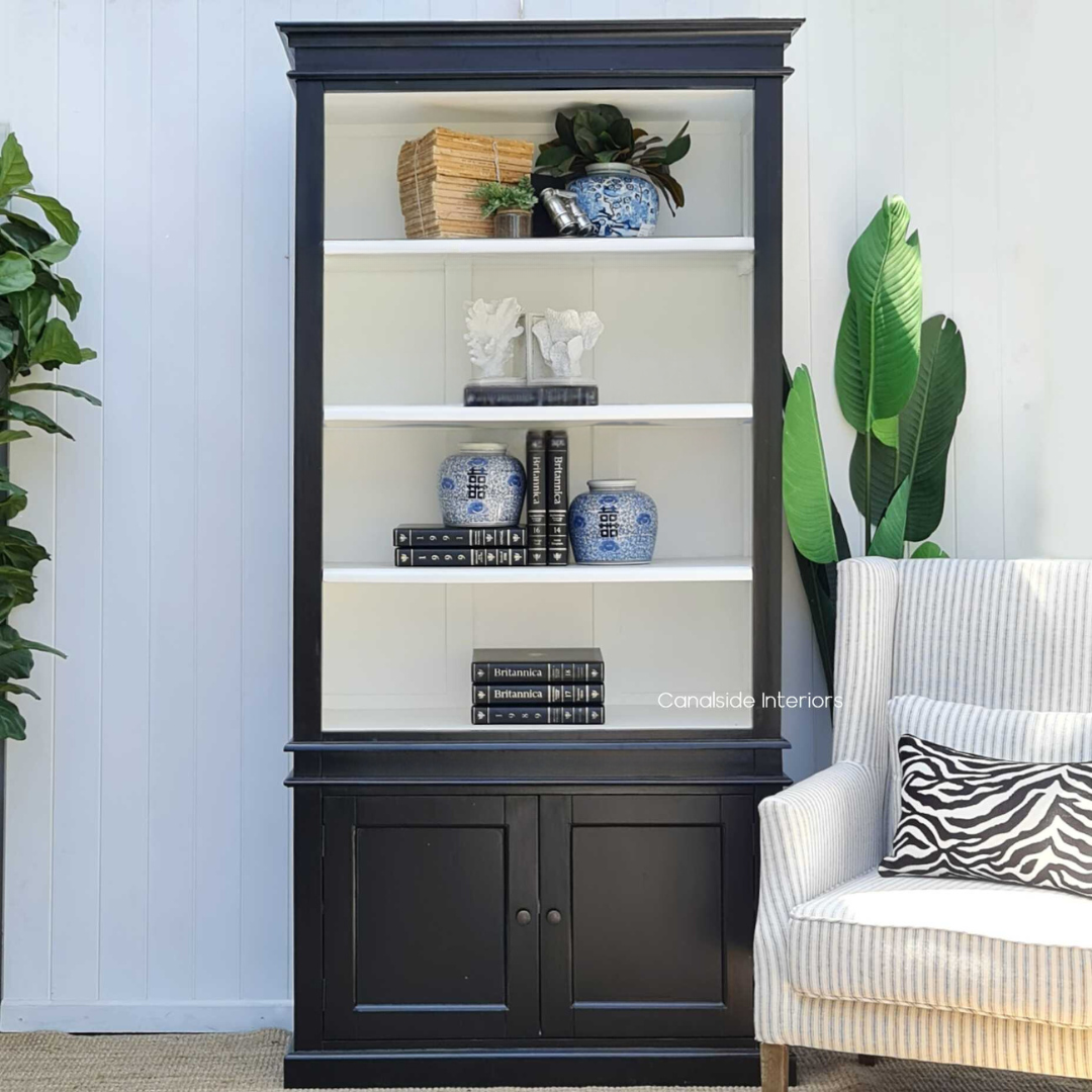 Frontal view of the Grange 2 Door Bookshelf Wall Unit in black with white interior, showcasing its spacious shelves - perfect for a Hamptons-style living room