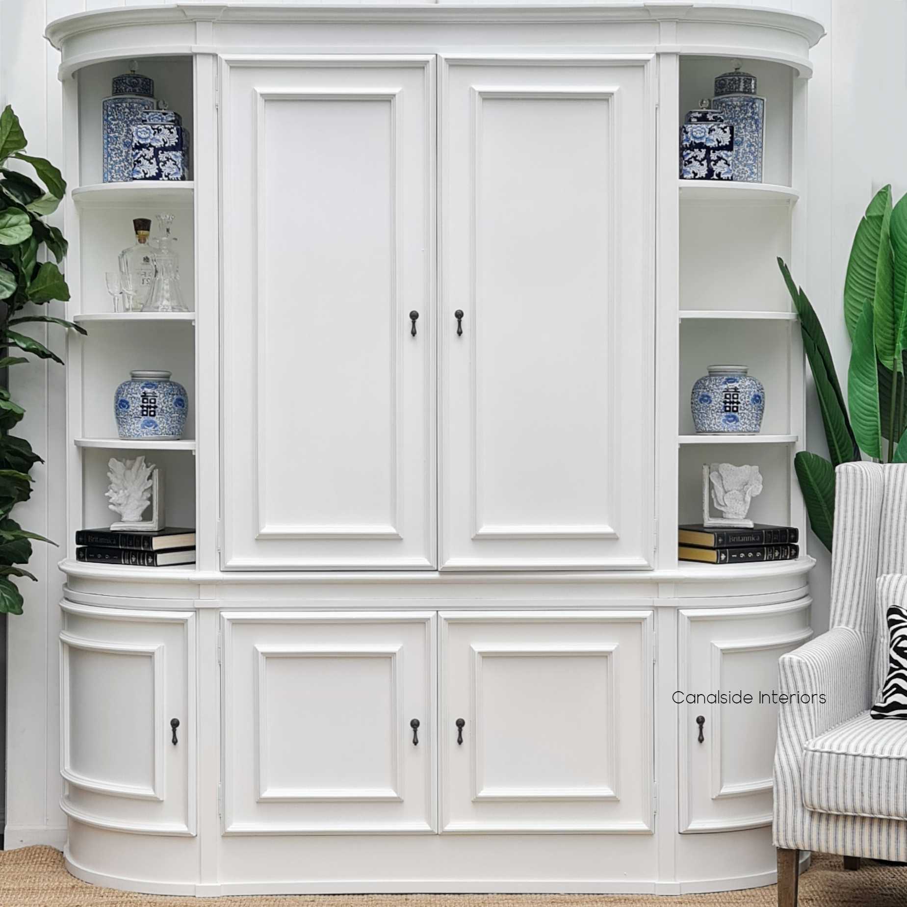 Interior scene with the Francia Curved Unit amidst other decor, illustrating its seamless fit into a chic, modern home office 