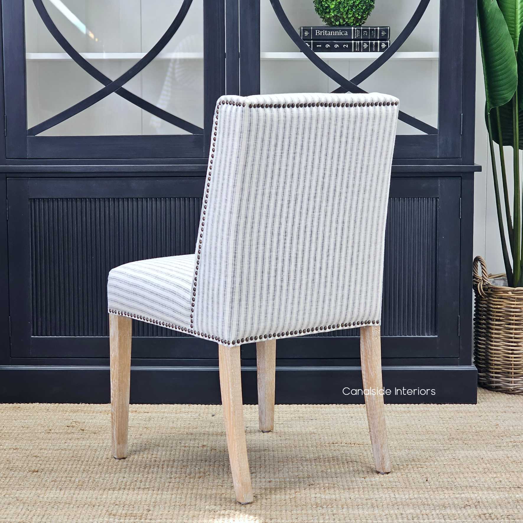 Rear view of the Leclerc Chair, highlighting the winged back design that stands proud under any dining table.