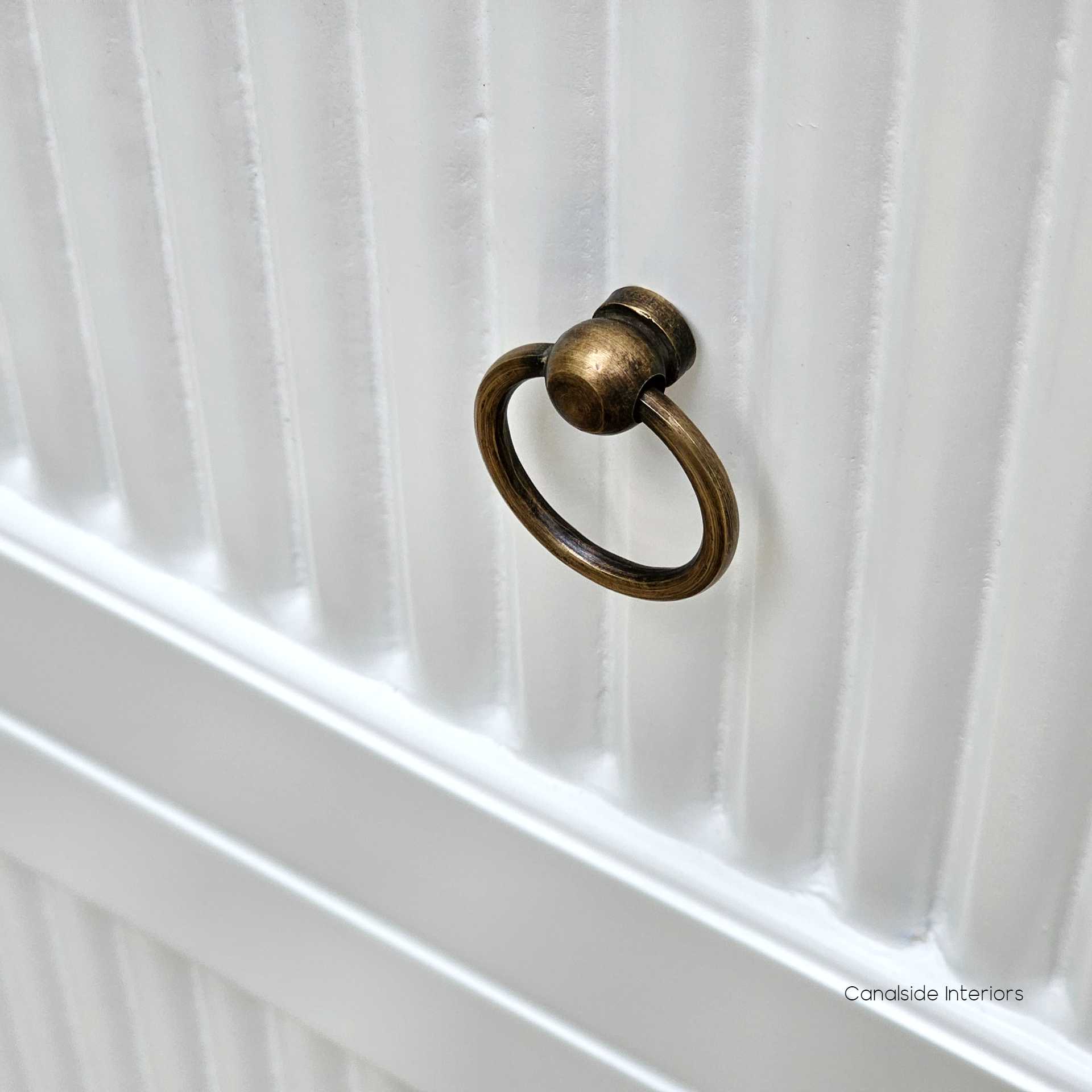 Frontal close-up of the Sorrento Chest, focusing on the distinctive fluted design and chic drawer handles.