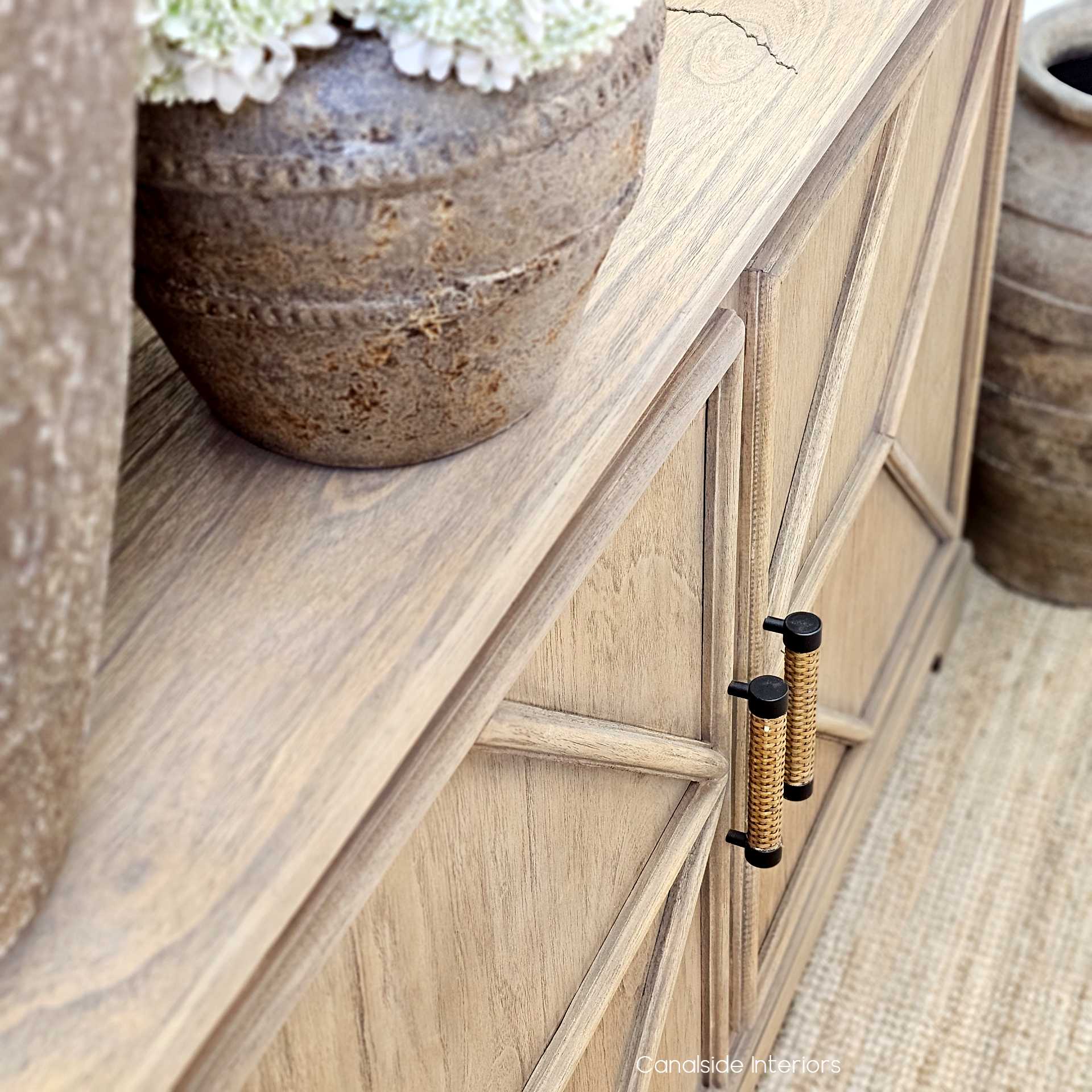 Detailed shot of the weathered oak timber grain across the cabinet front.